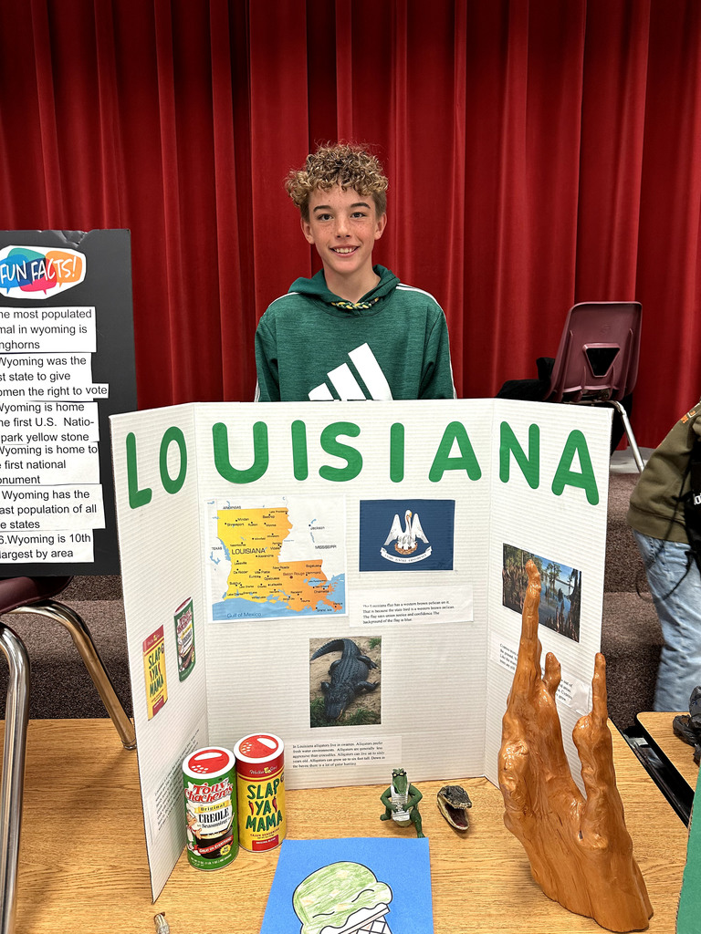 Student with poster about Louisiana