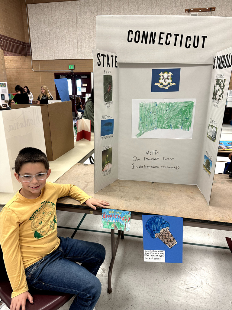 Student with poster about the state of Connecticut