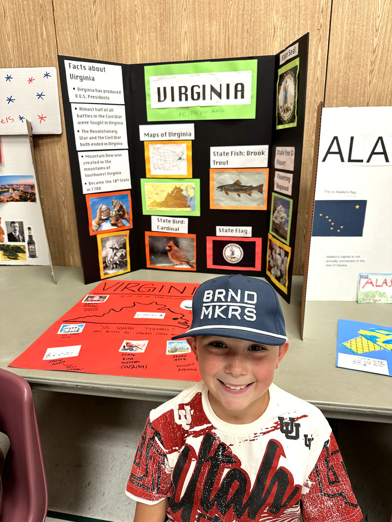 Student with poster about the state of Virginia