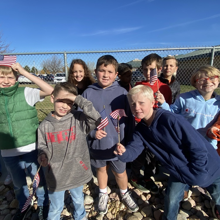 a group of students holding American flags 