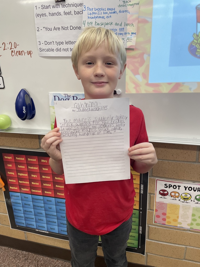 student posing with their poem