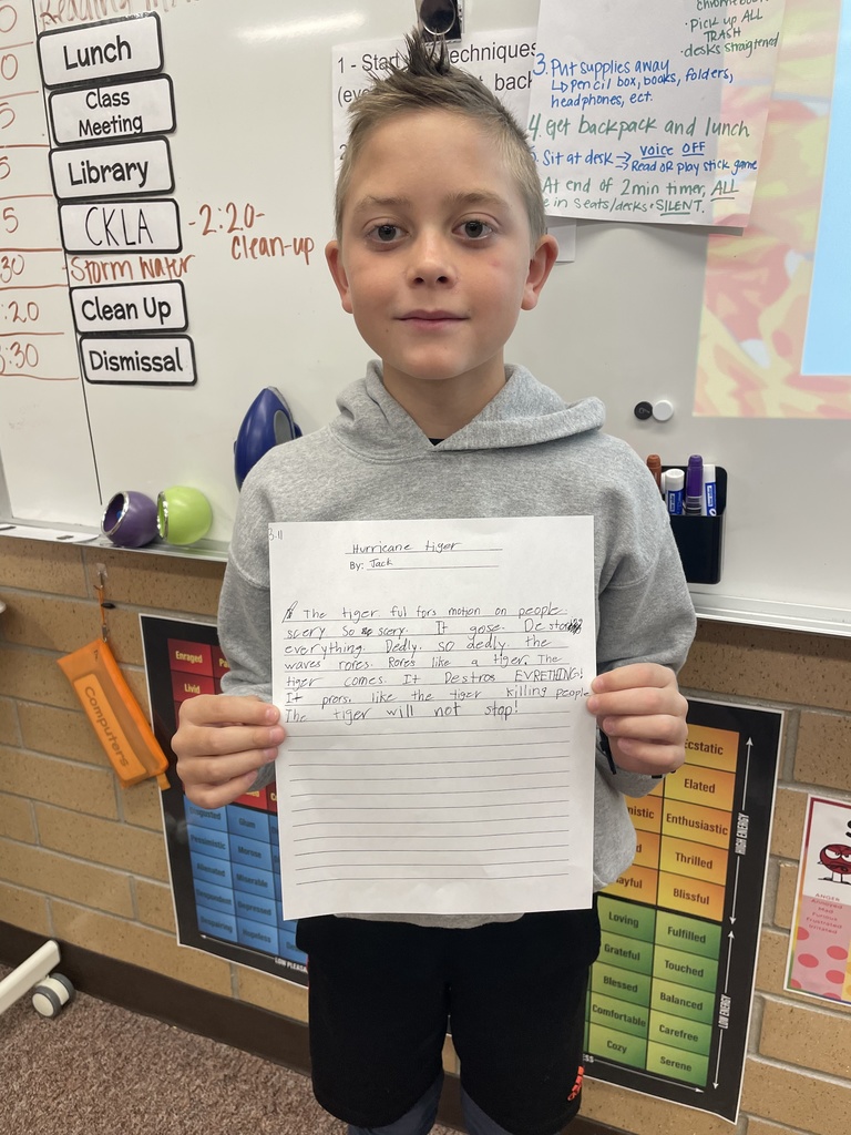 student posing with their poem