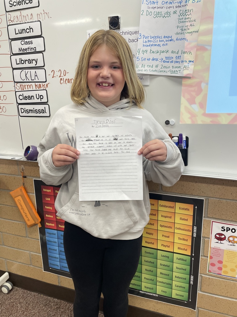 student posing with their poem