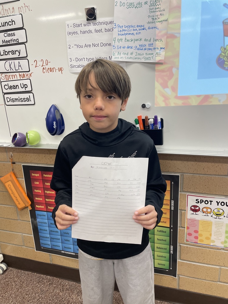 student posing with their poem