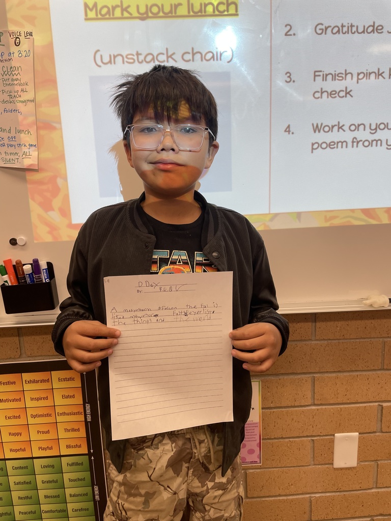 student posing with their poem