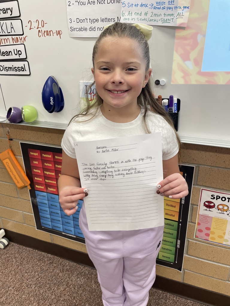 student posing with their poem