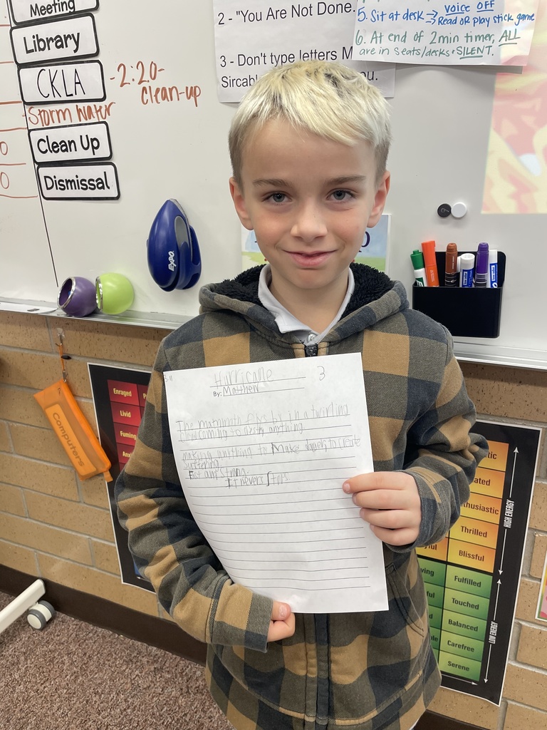 student posing with their poem