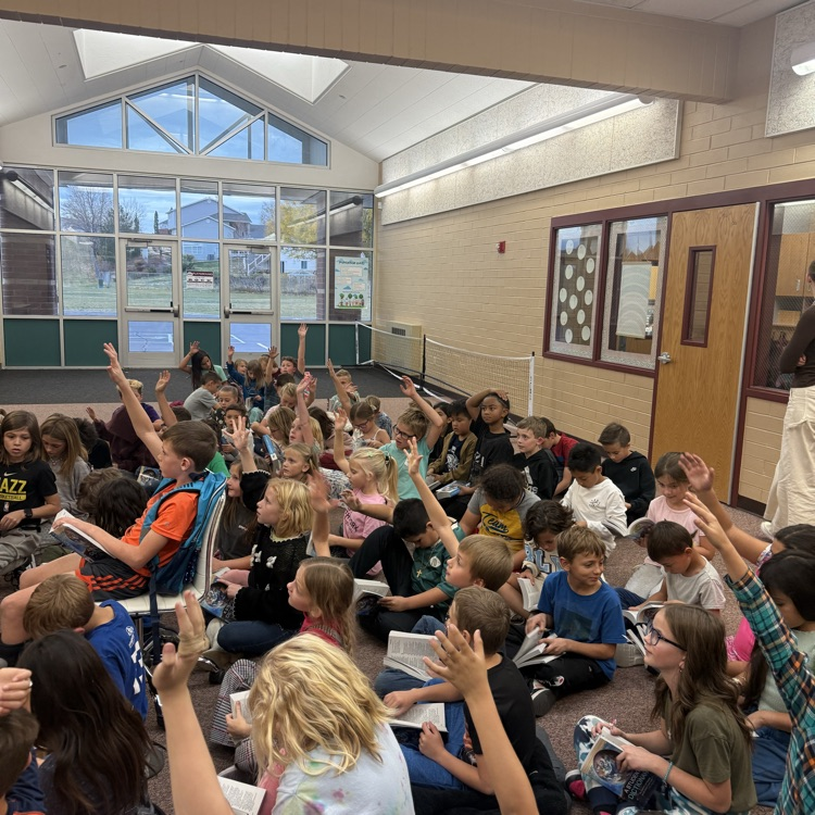 students looking at dictionaries