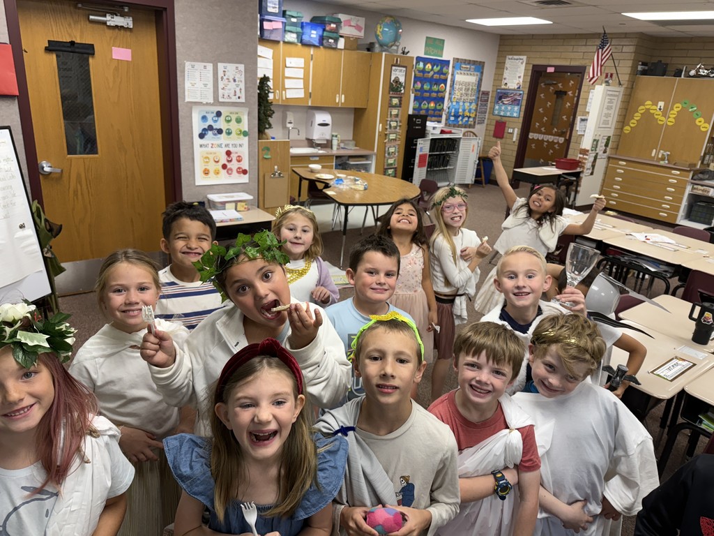 2nd grade students enjoying tazki and grape juice