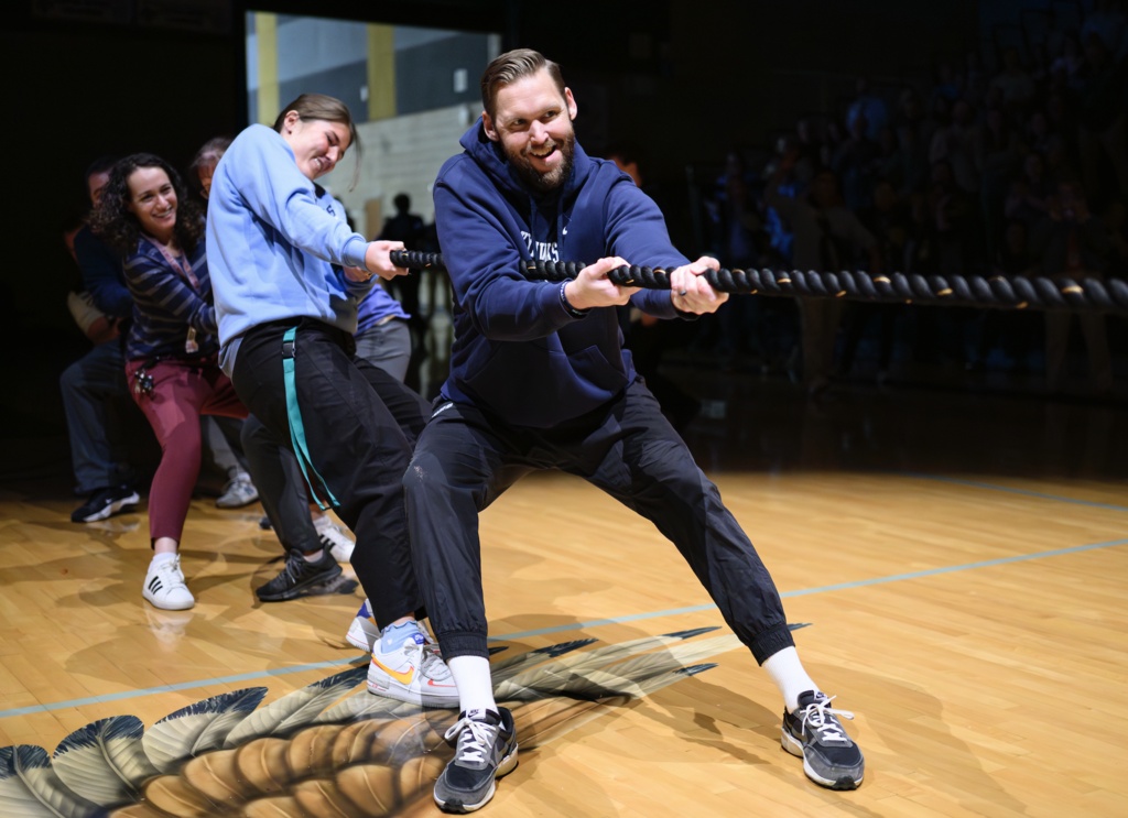 Teachers in the spotlight in a tug of war for the make a wish assembly