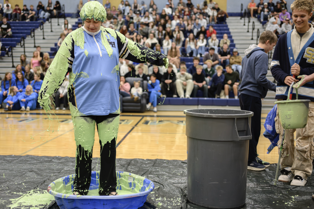 Teacher getting slimed at the Make a Wish Assembly