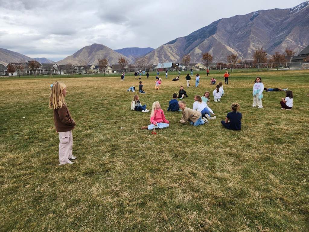 Students playing "Run and Scream" on the field.