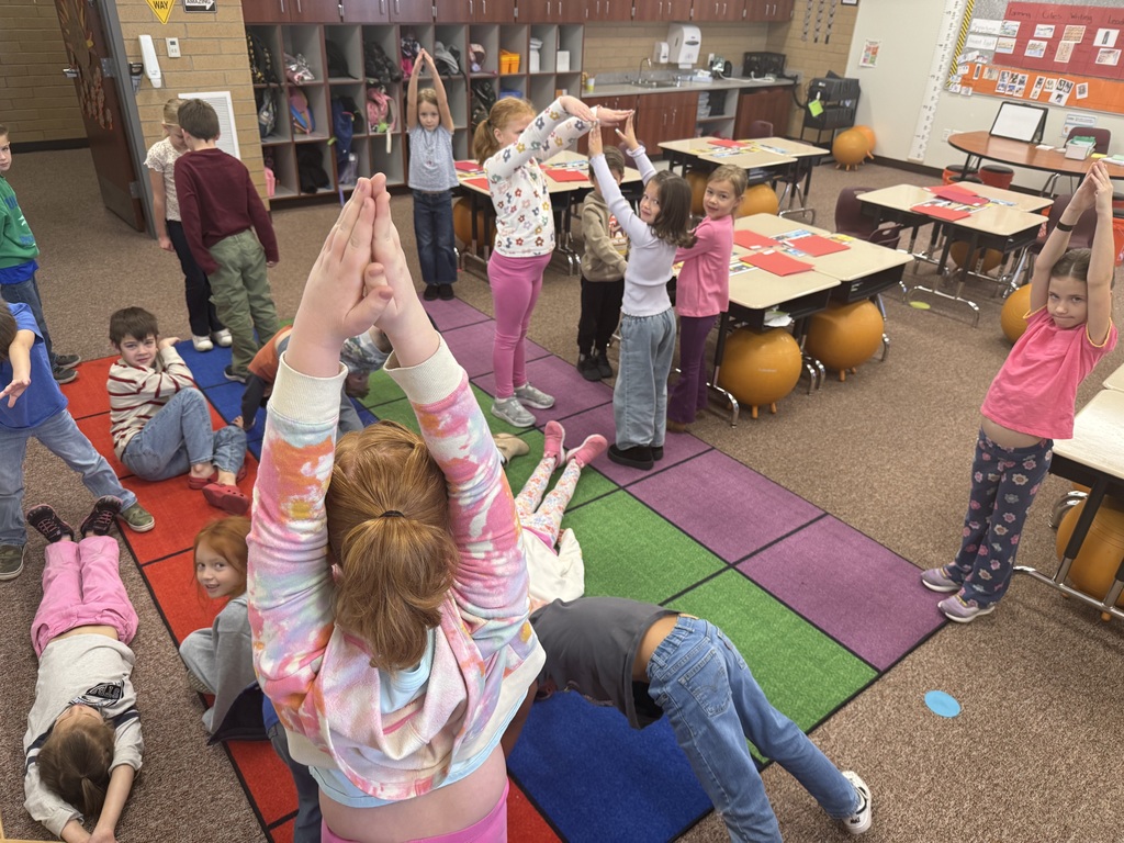 Students making shapes with their bodies