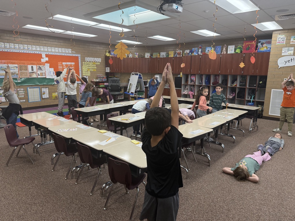 Students making shapes with their bodies