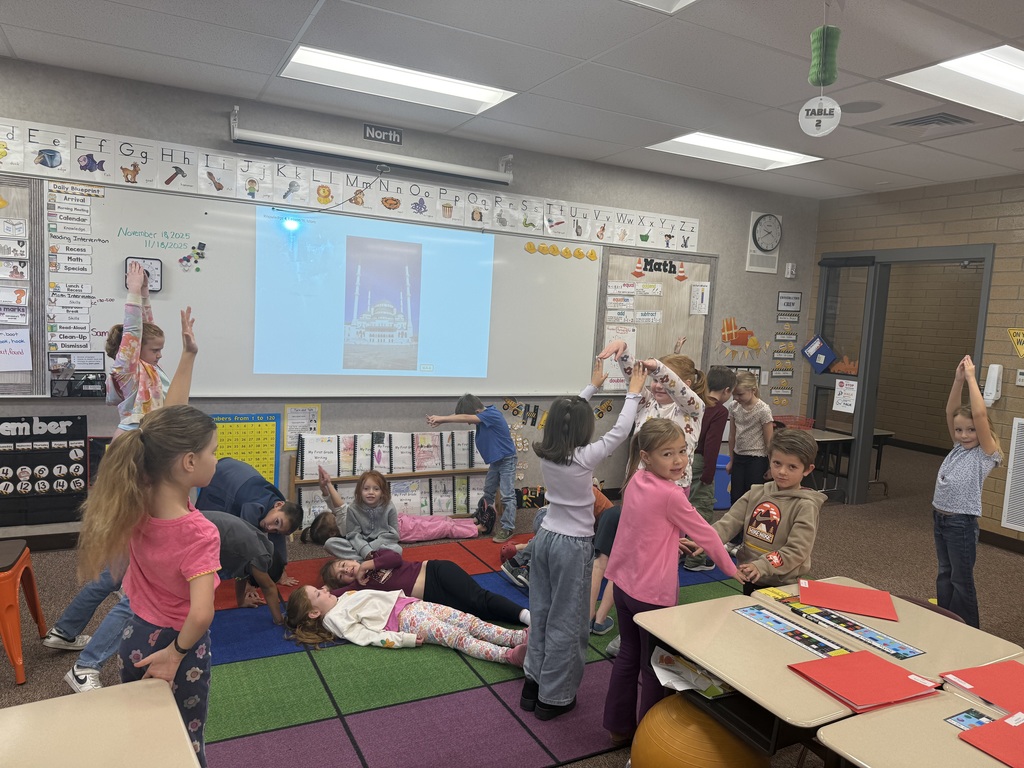 Students making shapes with their bodies