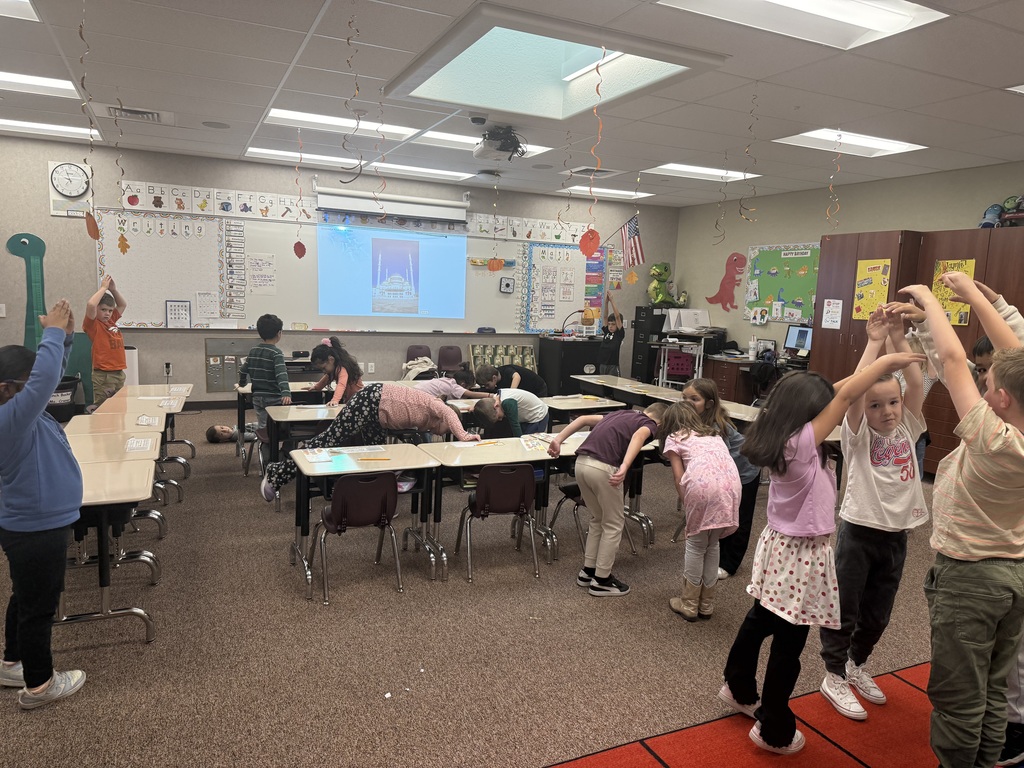 Students making shapes with their bodies