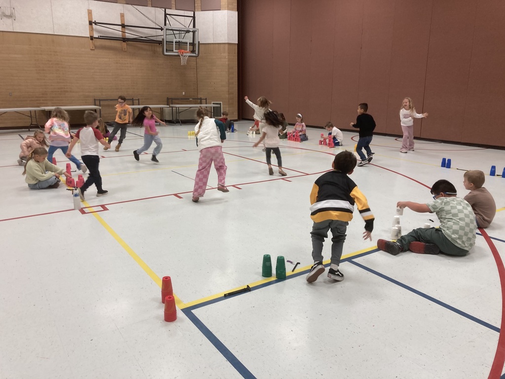 Students playing Everyone is it while stacking when tagged out