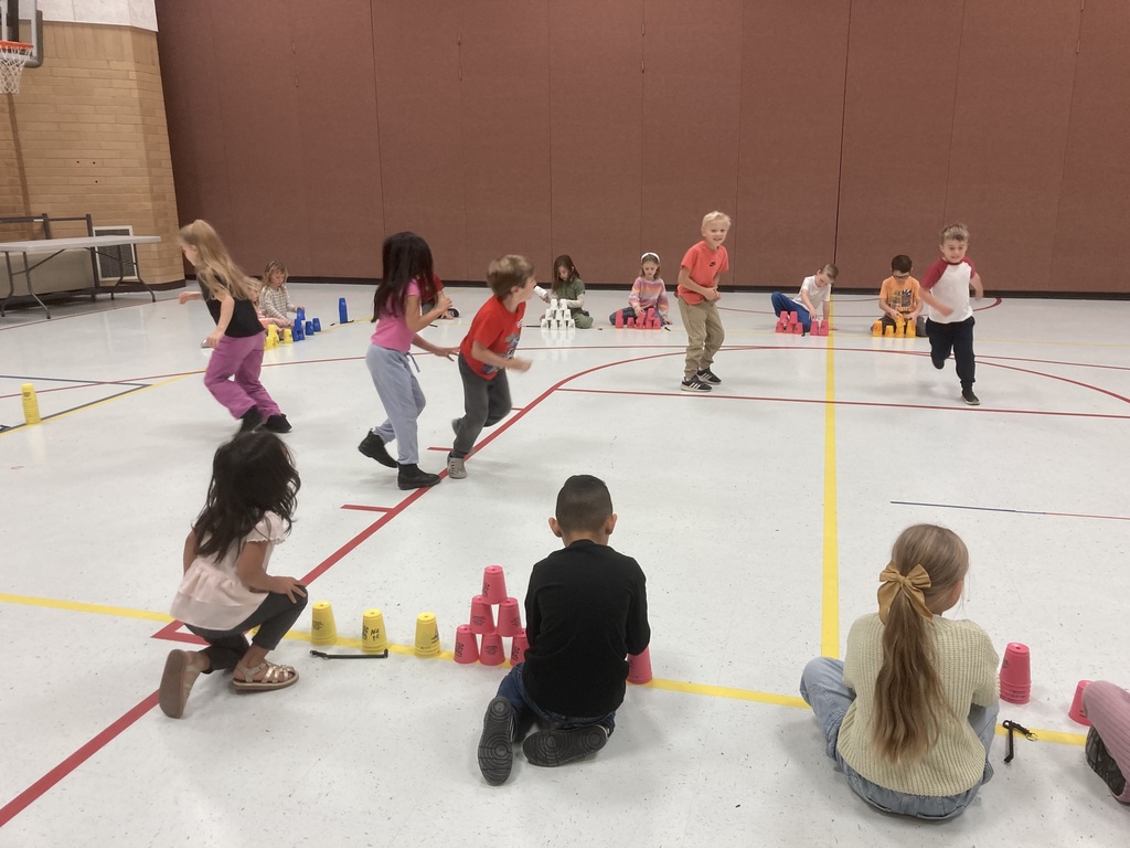 Students playing Everyone is it while stacking when tagged out