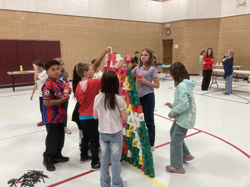 Students building a cup tower
