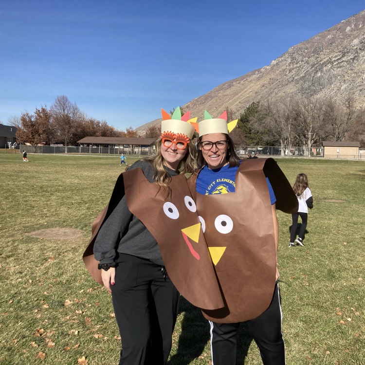 Third Grade teacher decorated as turkeys running the Turkey trot