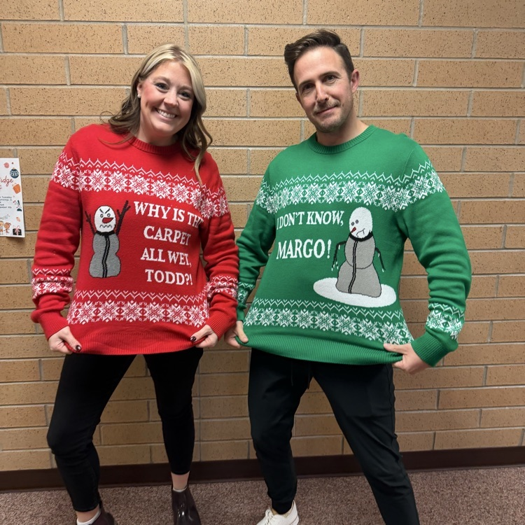 Mrs. Williams and Mr. Lee in their Christmas sweaters