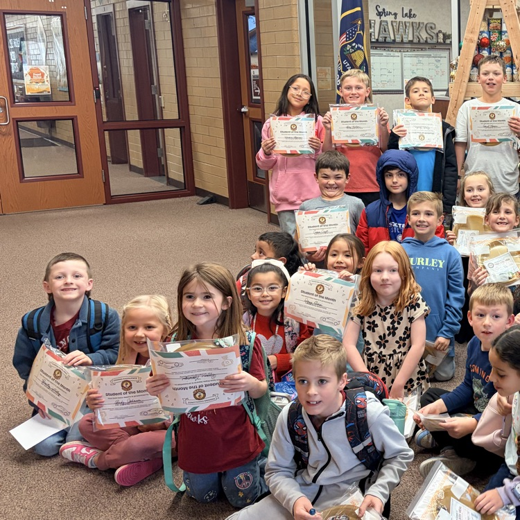 a group of students holding certificates
