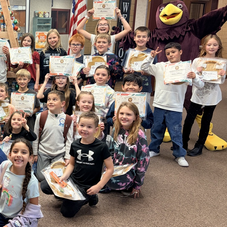 a group of students holding certificates