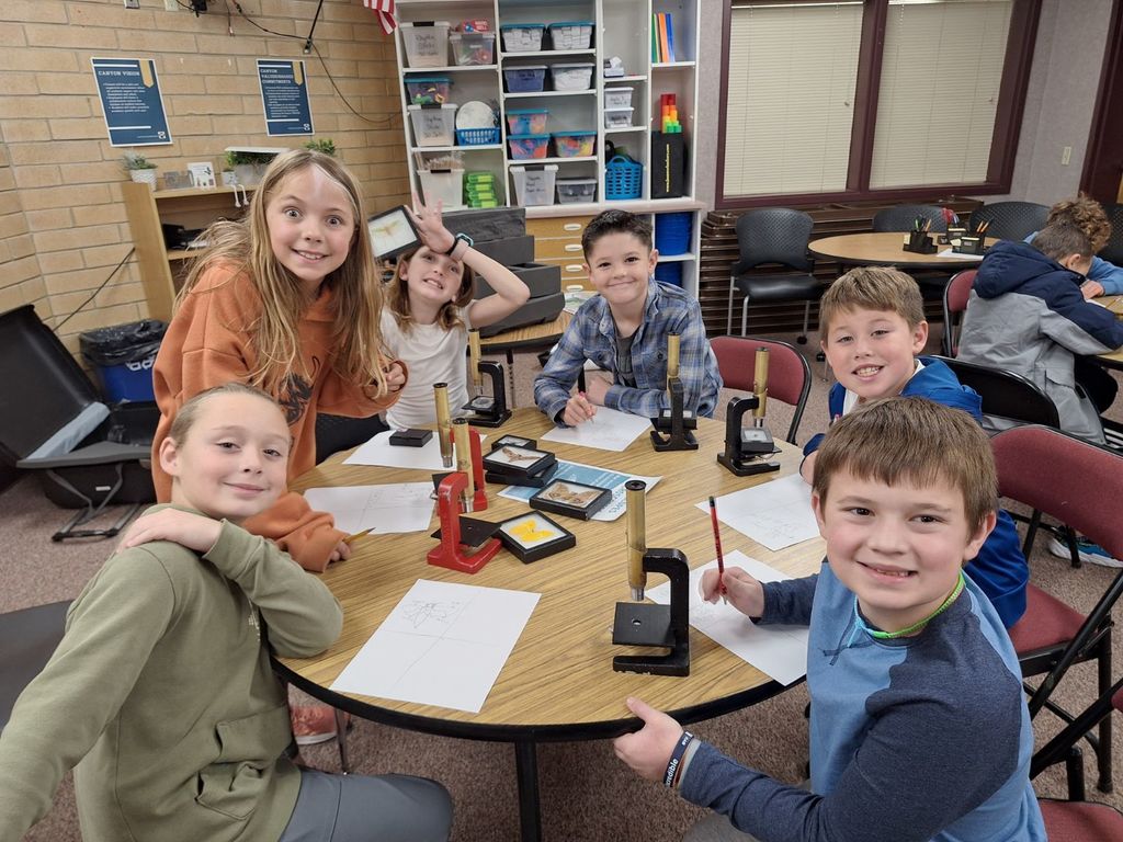 Students using microscopes