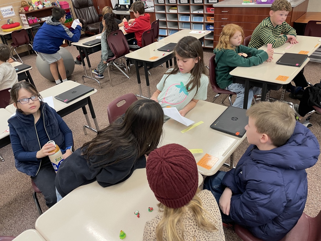kids discussing at their tables