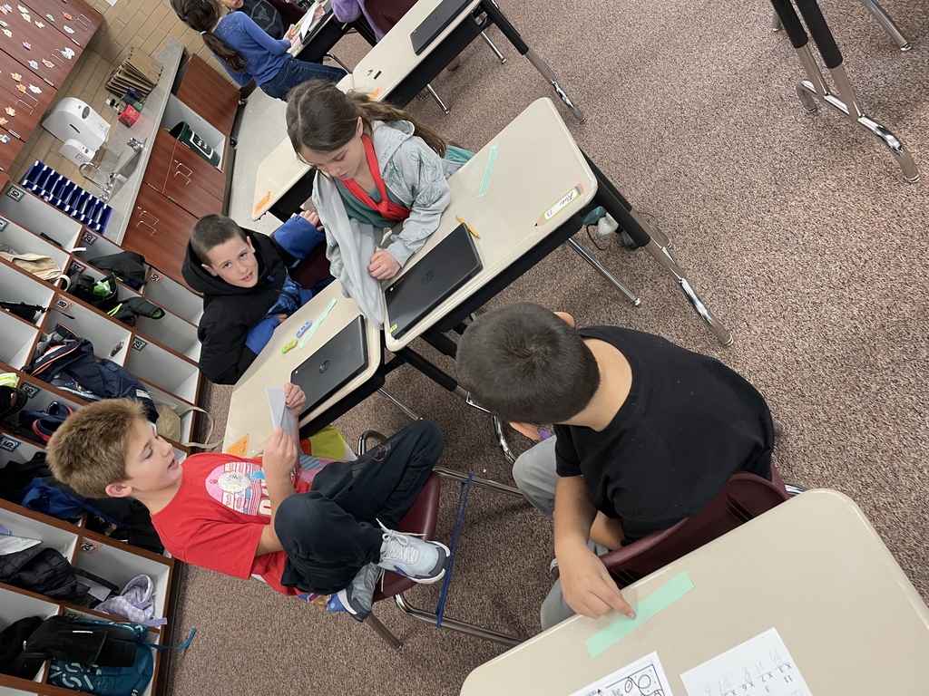 kids discussing at their tables