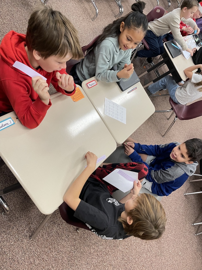 kids discussing at a table