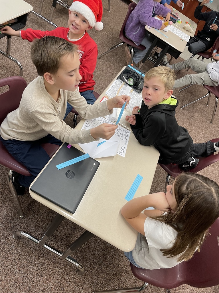 kids discussing at their tables
