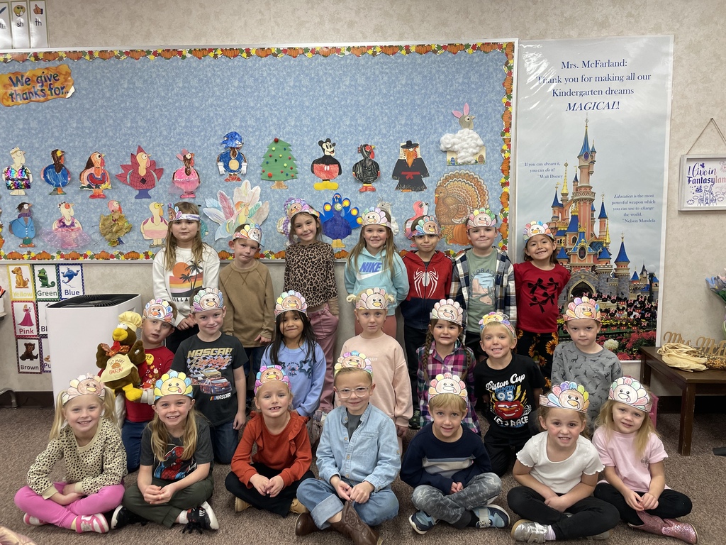 three rows of students with turkey headbands on their heads