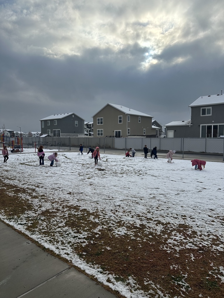 kids playing outside in the snow