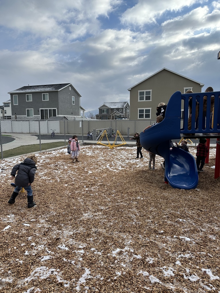 kids playing outside in the snow