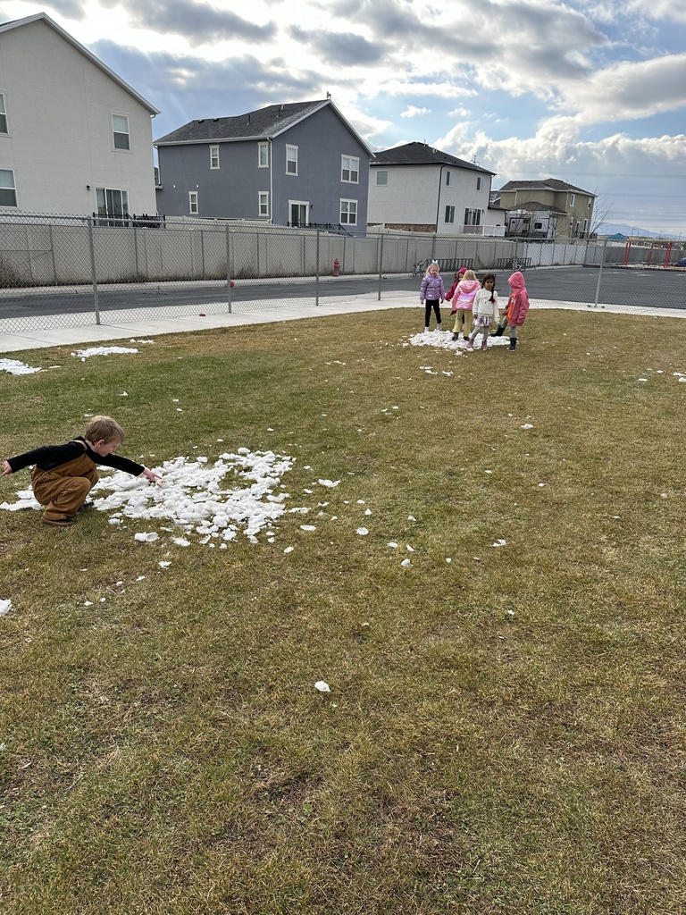 kids playing outside in the snow