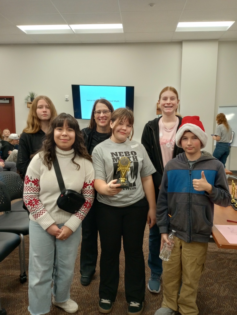Math Team participants posing with trophy