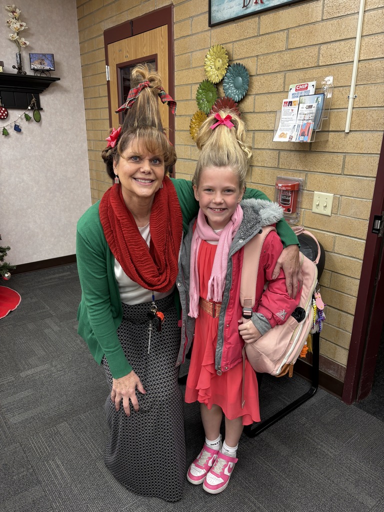 Principal and student dressed up as Cindy Lou