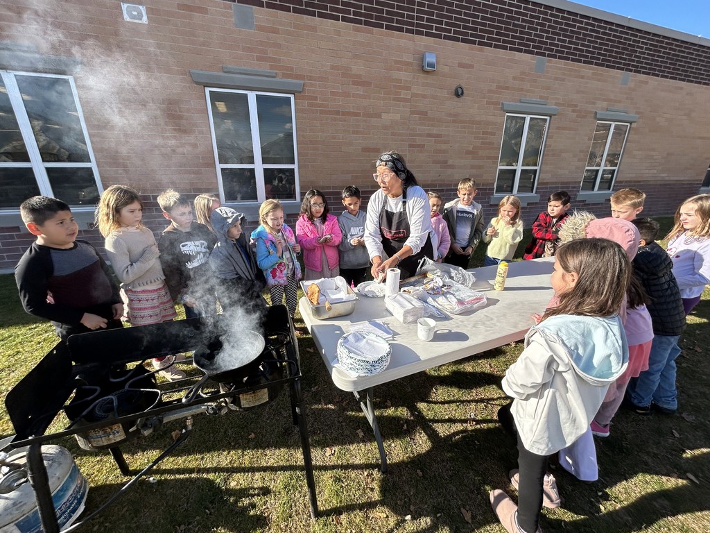 second graders having fry bread 