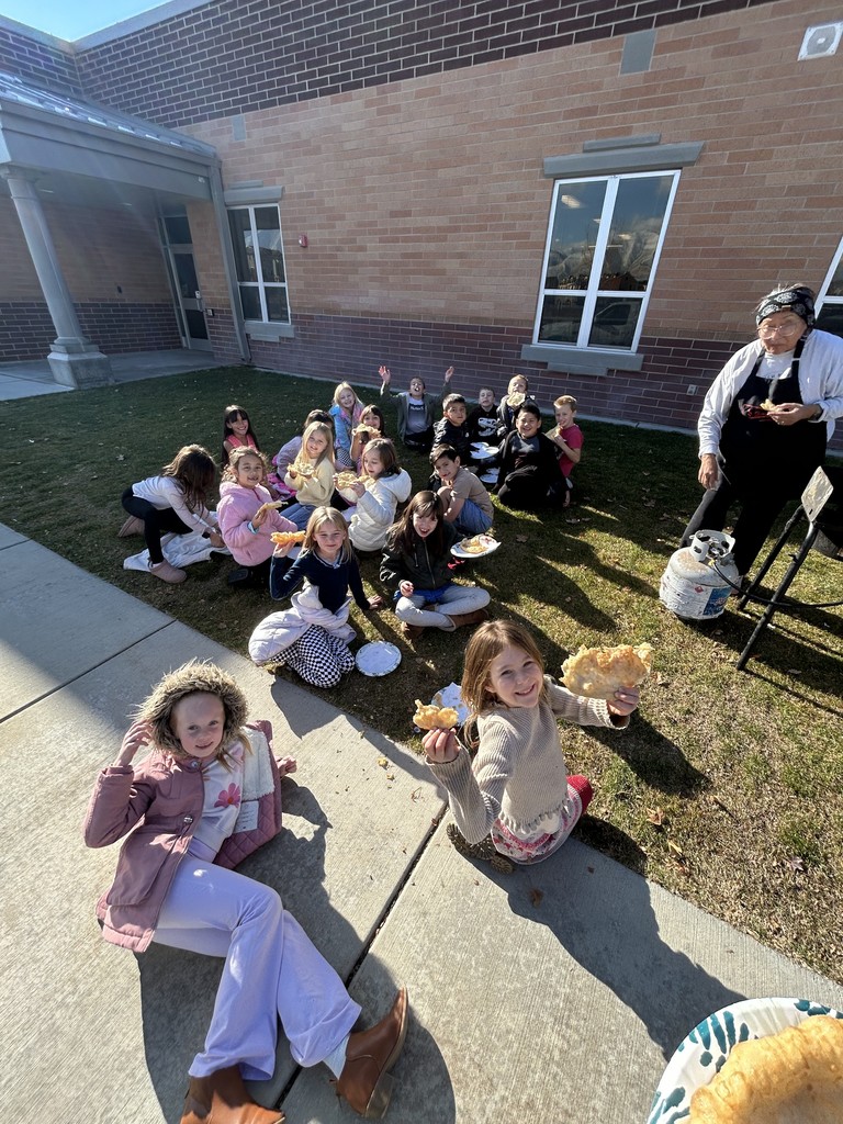 second graders eating fry bread