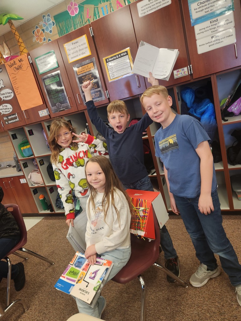 students posing with their invention 