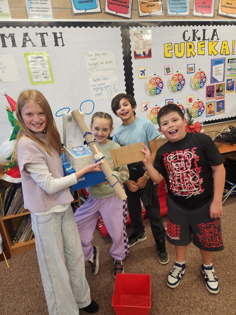 students posing with their invention 