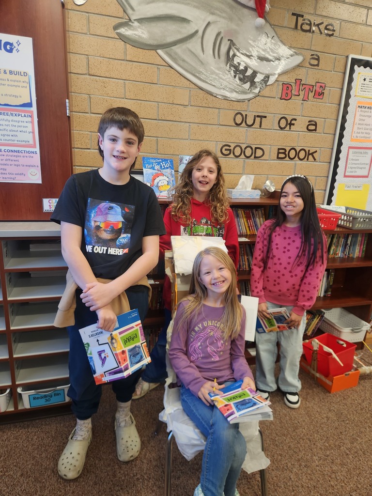 students posing with their invention 