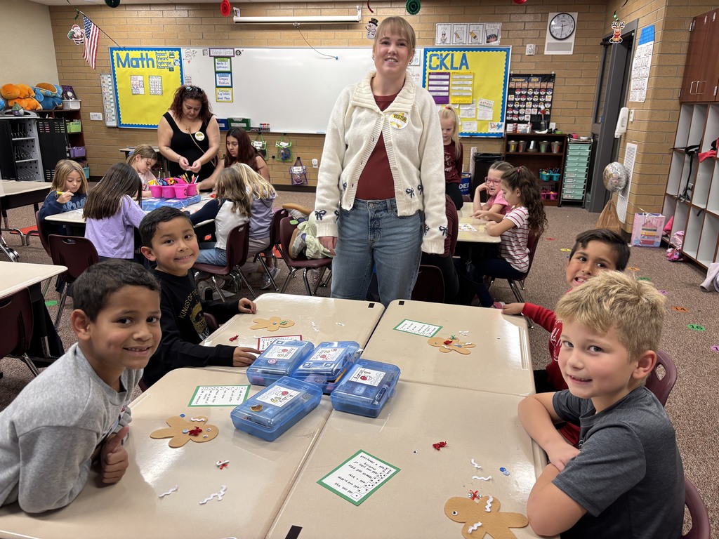 students with a parent playing a game