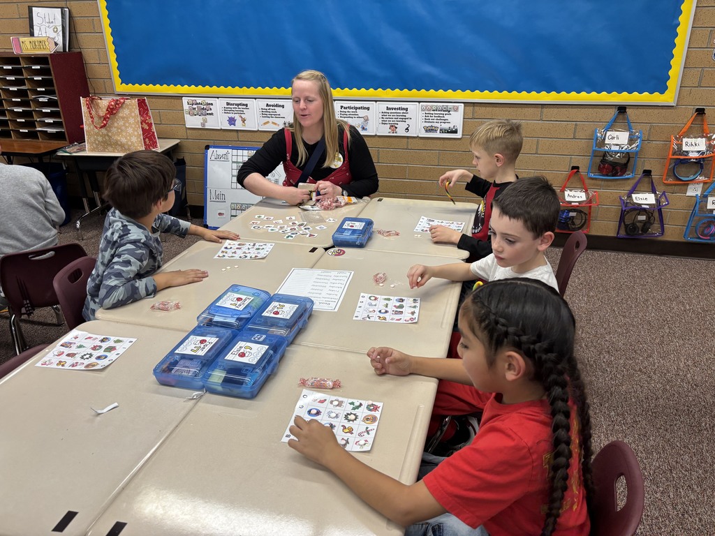 students playing a game with a parent