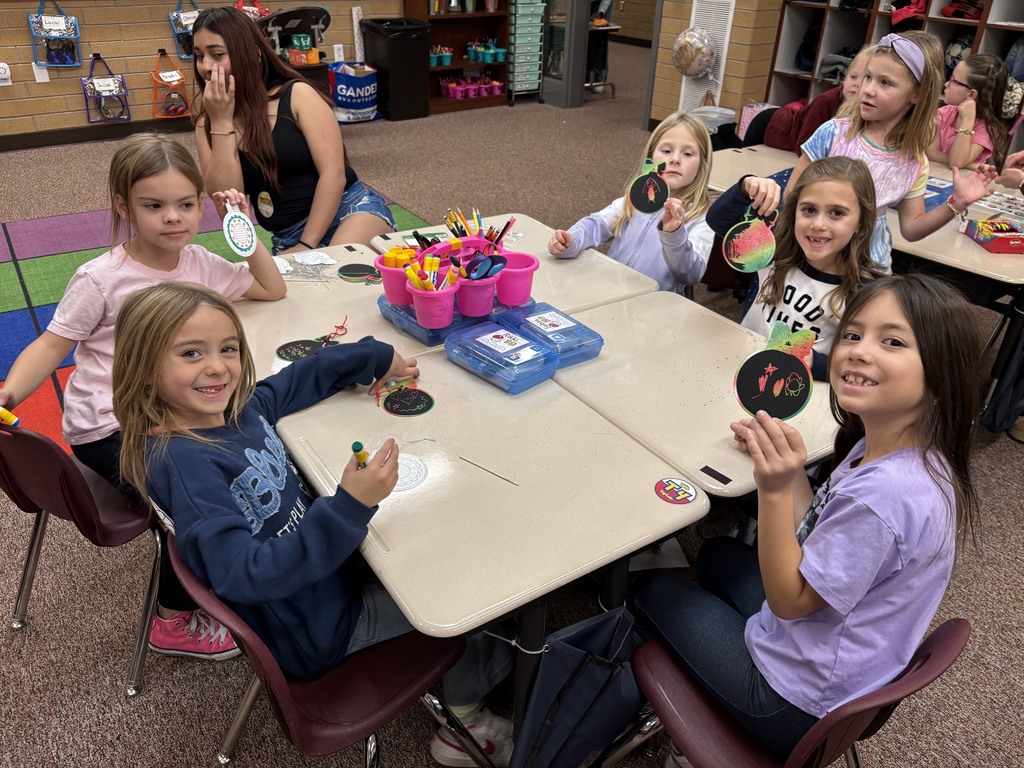 students posing with their crafts