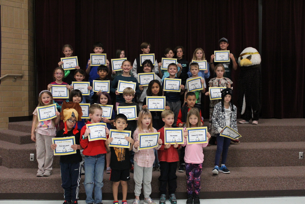 November Stand Strong Students holding certificates