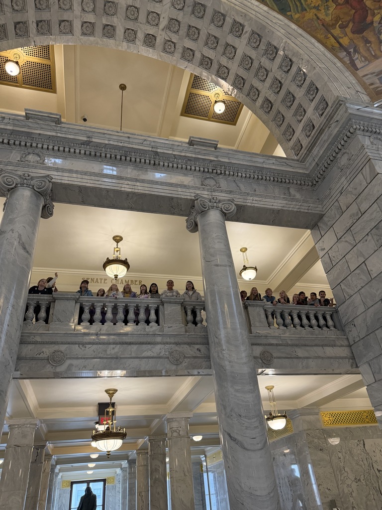 Students looking over the balcony at the Capitol building