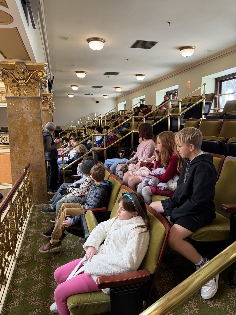Students listening to a tour guide in the capitol 