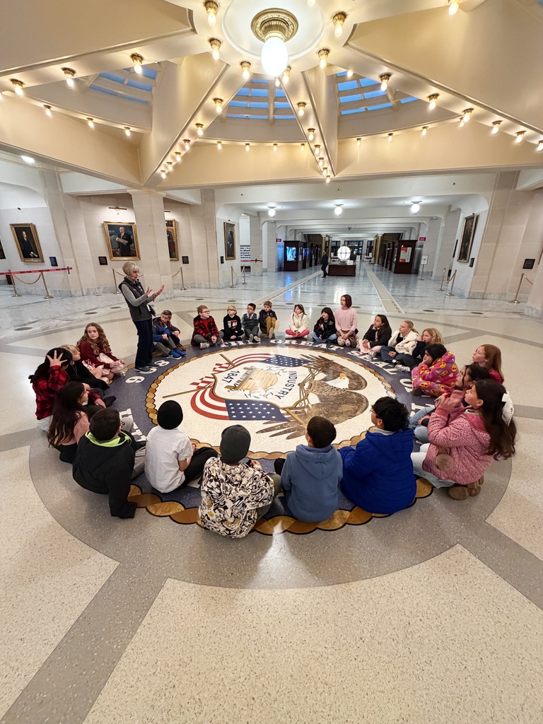 Students listening to a tour guide in the capitol 